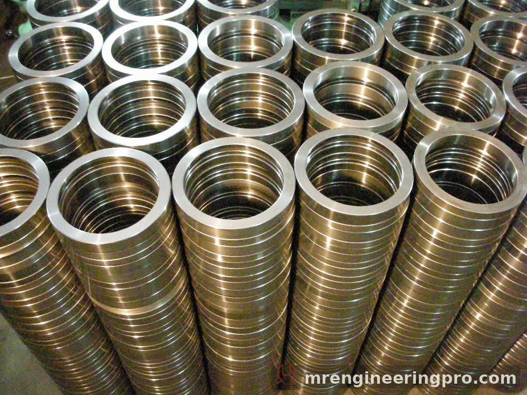 Machined DN125 end rings stacked in quantity at M. R. Engineering