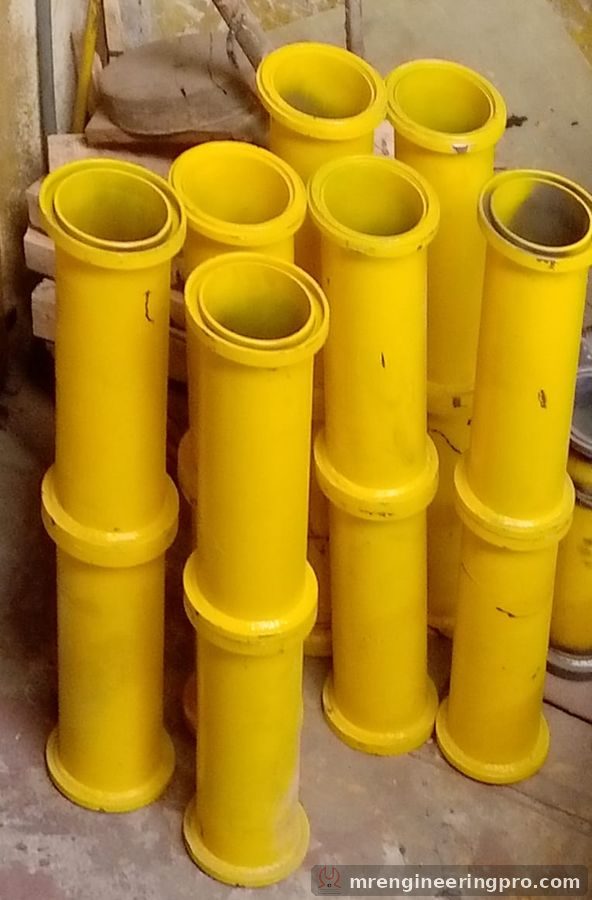 Short DN125 pipes and reducers with end collars, painted